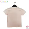 elegant beige kid girl crew neck t-shirt: trendy and breathable activewear