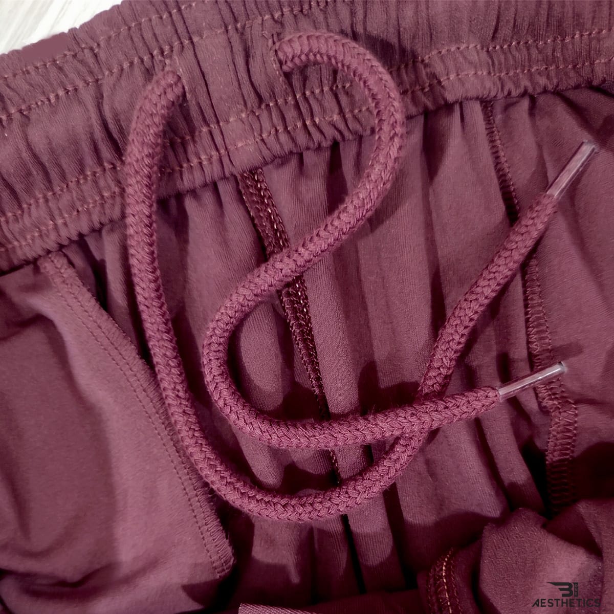 thletic track bottoms waistband detail showing secure elastic core and adjustable inside drawstring