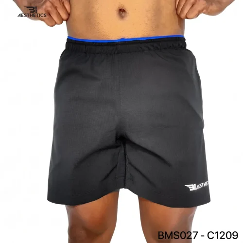 Athlete stretching legs wearing Zipper Pocket Shorts with side contrast panel