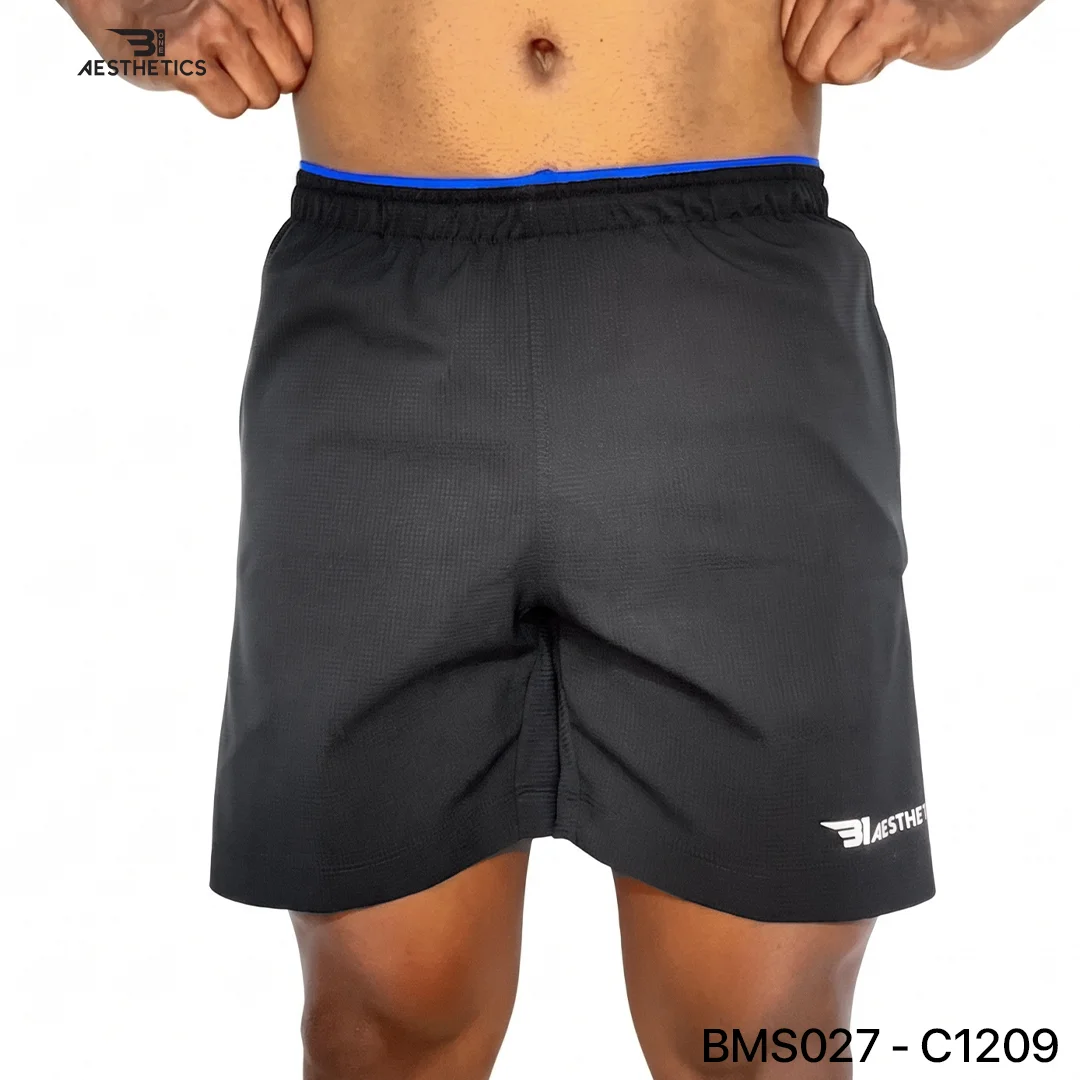 Athlete stretching legs wearing Zipper Pocket Shorts with side contrast panel