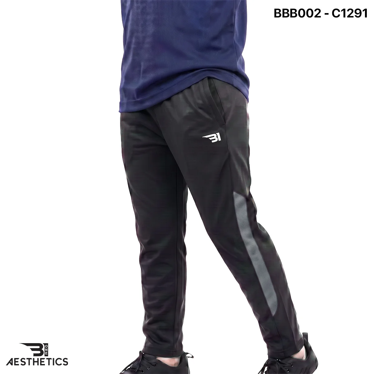 Boys sports track bottoms side view highlighting breathable mesh panel