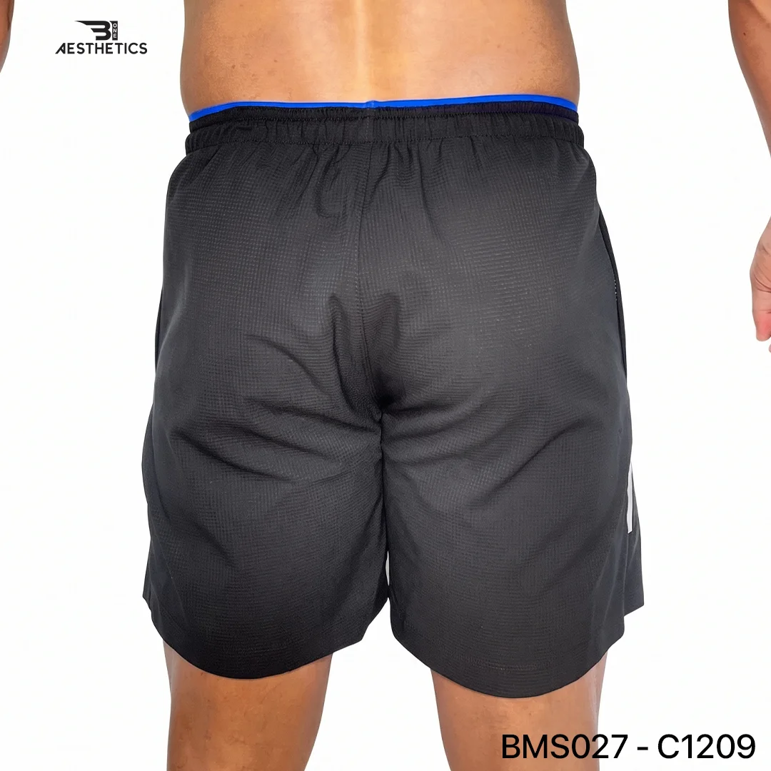 Athlete stretching legs wearing Zipper Pocket Shorts with side contrast panel