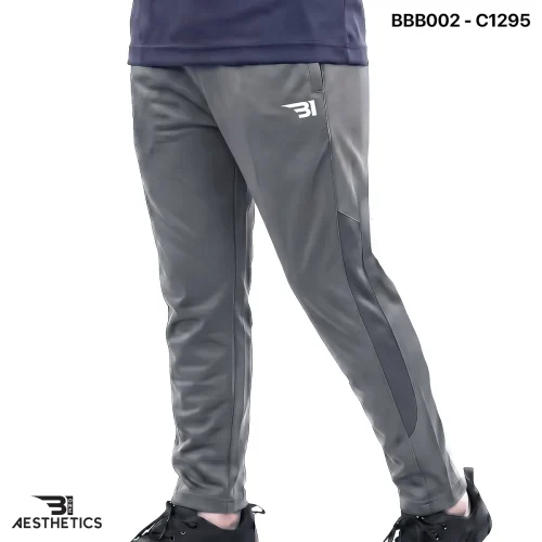 Boys sports track bottoms side view highlighting breathable mesh panel