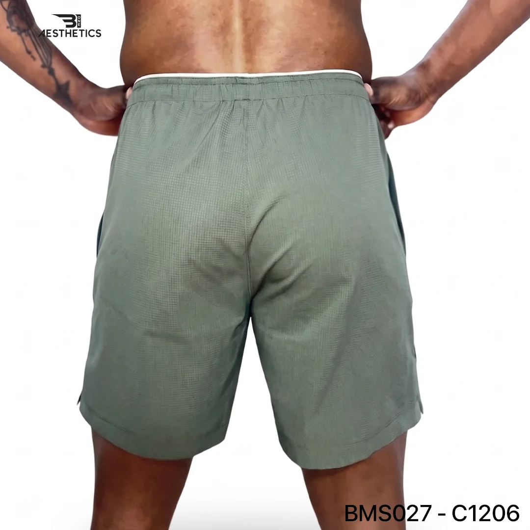 Athlete stretching legs wearing Zipper Pocket Shorts with side contrast panel