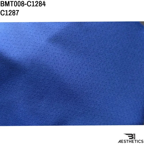 Close up of premium breathable dry fit fabric texture and stitching detail