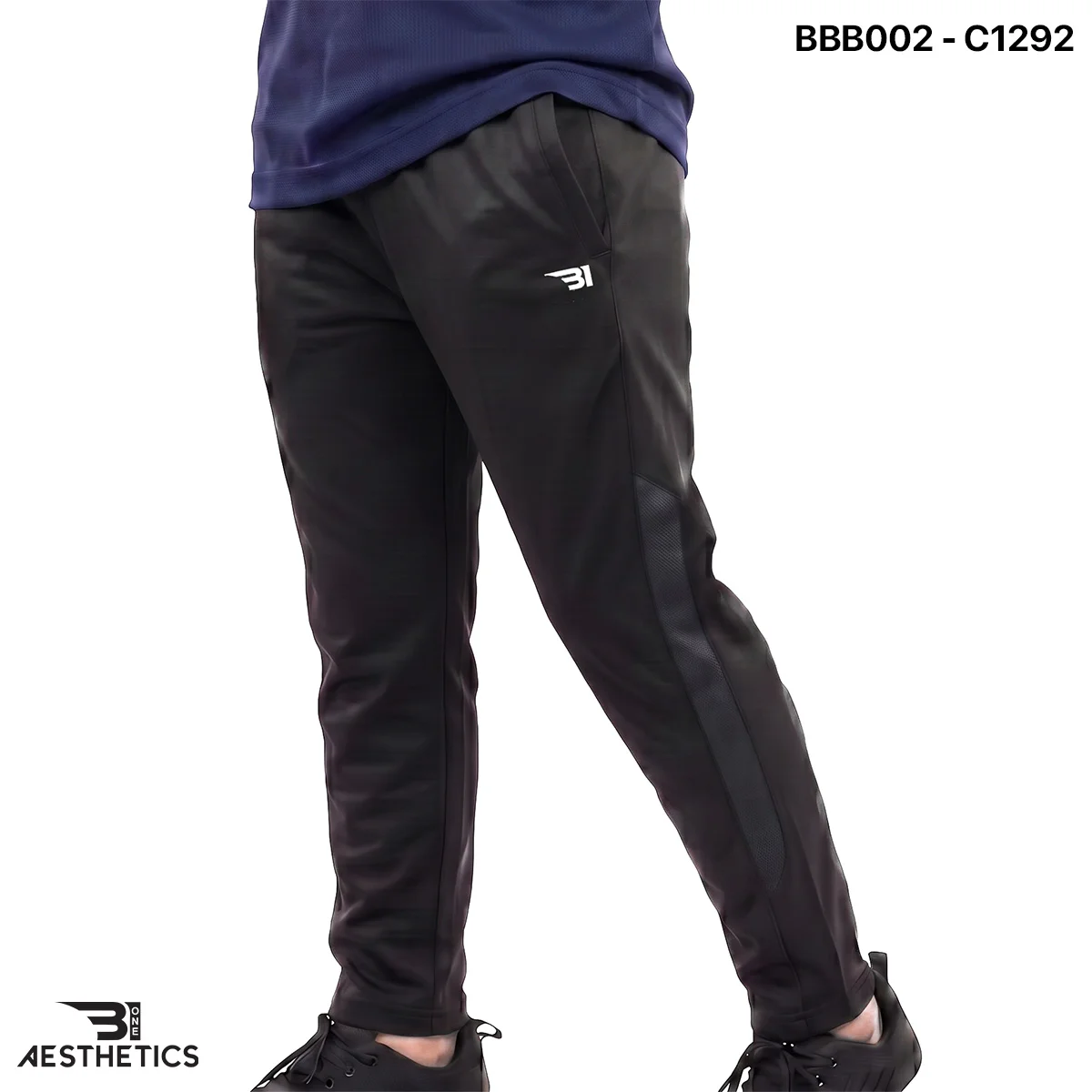 Boys sports track bottoms side view highlighting breathable mesh panel