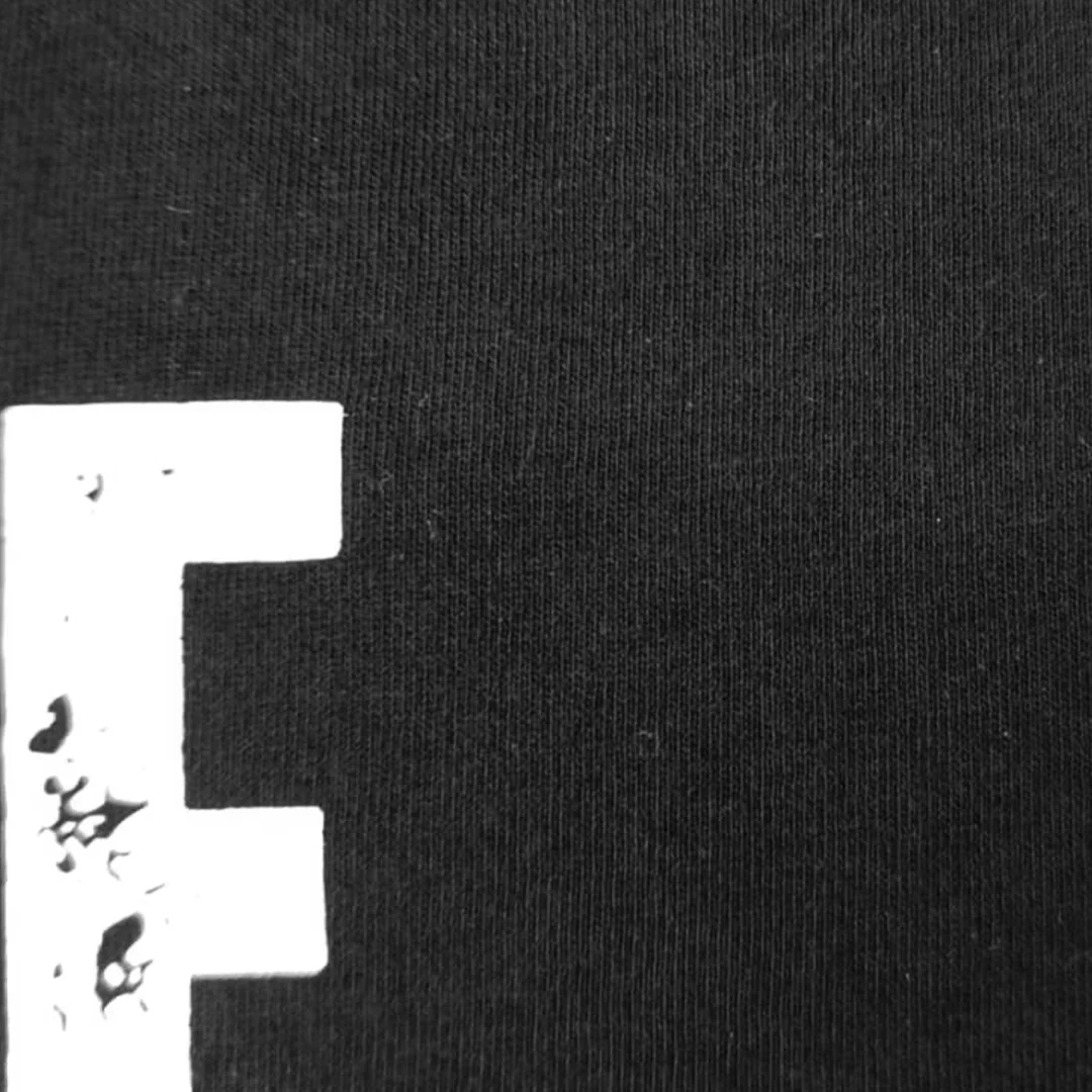 Close up of premium breathable cotton fabric and print of oversized t-shirt