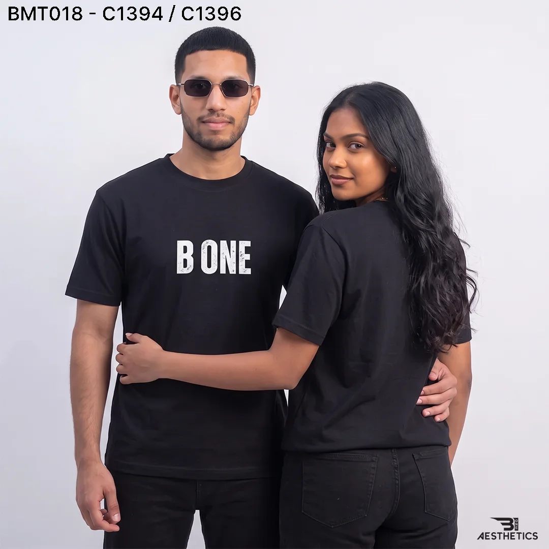 Unisex minimal oversized t-shirt worn by male and female models showcasing clean streetwear fit