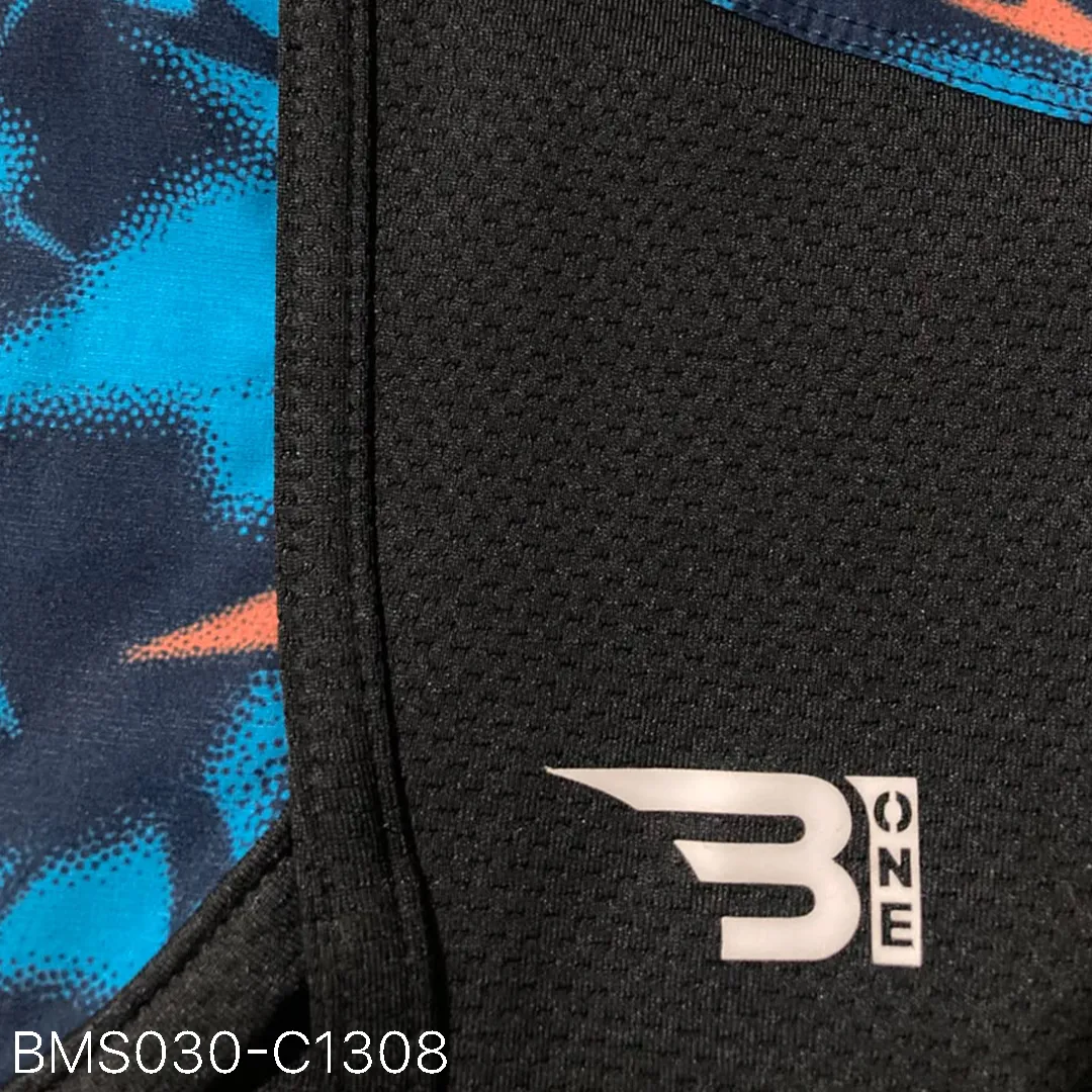 Close up of practice short breathable eyelet mesh fabric and high-density logo