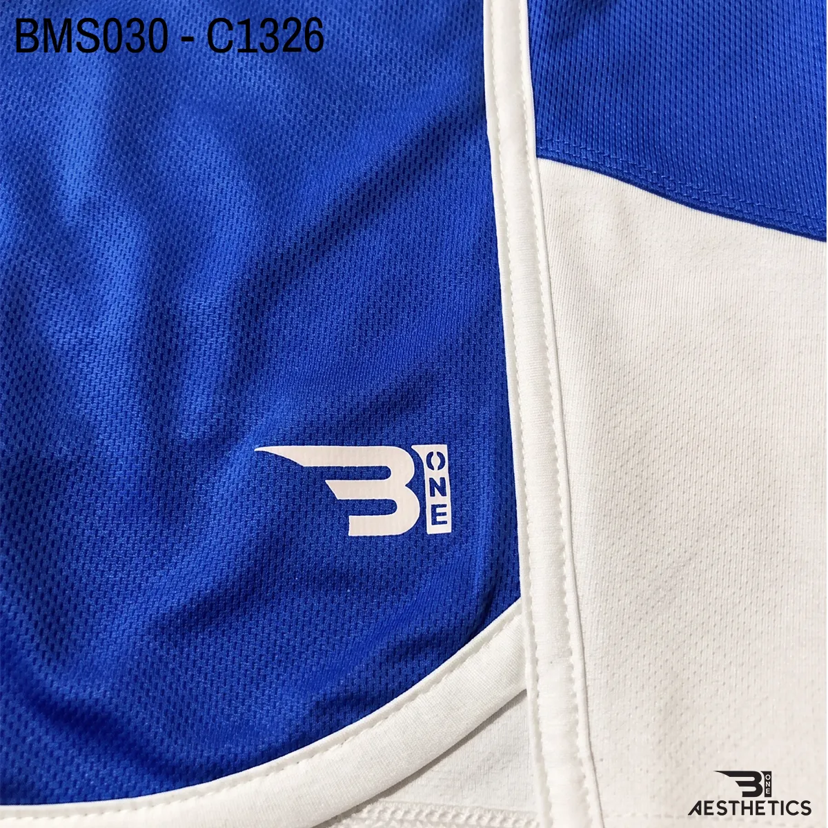 Close up of practice short breathable eyelet mesh fabric and high-density logo
