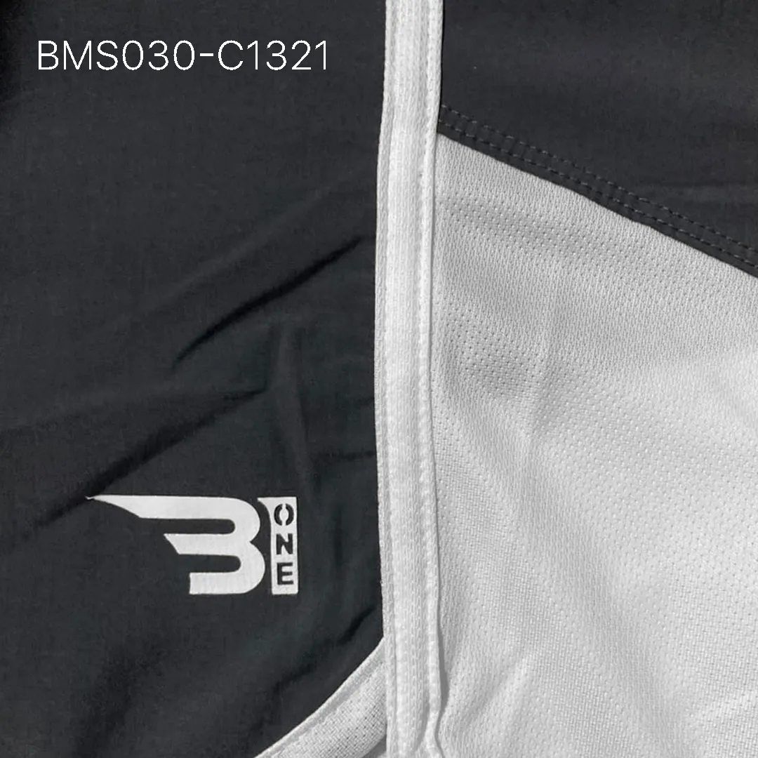 Close up of practice short breathable eyelet mesh fabric and high-density logo