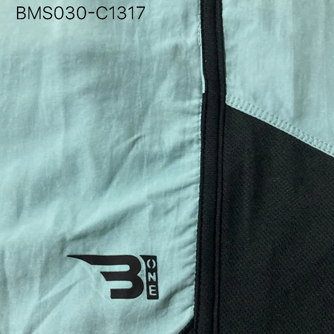 Close up of practice short breathable eyelet mesh fabric and high-density logo