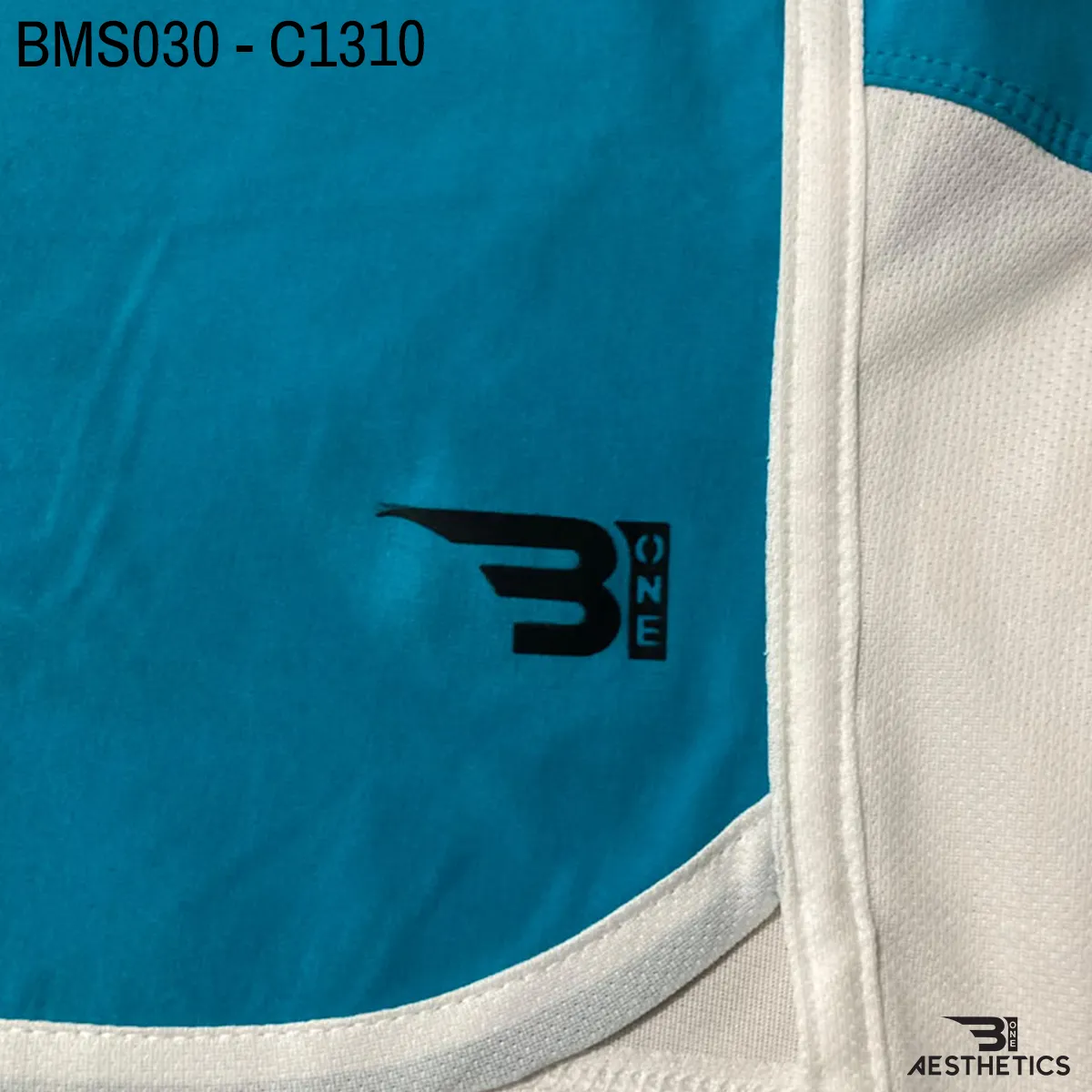 Close up of practice short breathable eyelet mesh fabric and high-density logo