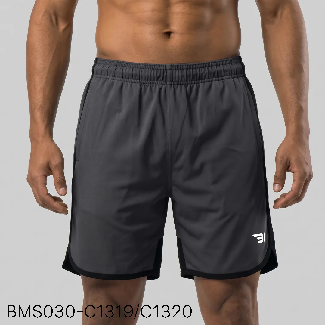 Men's practice short front view showing elastic waistband and curved hem split