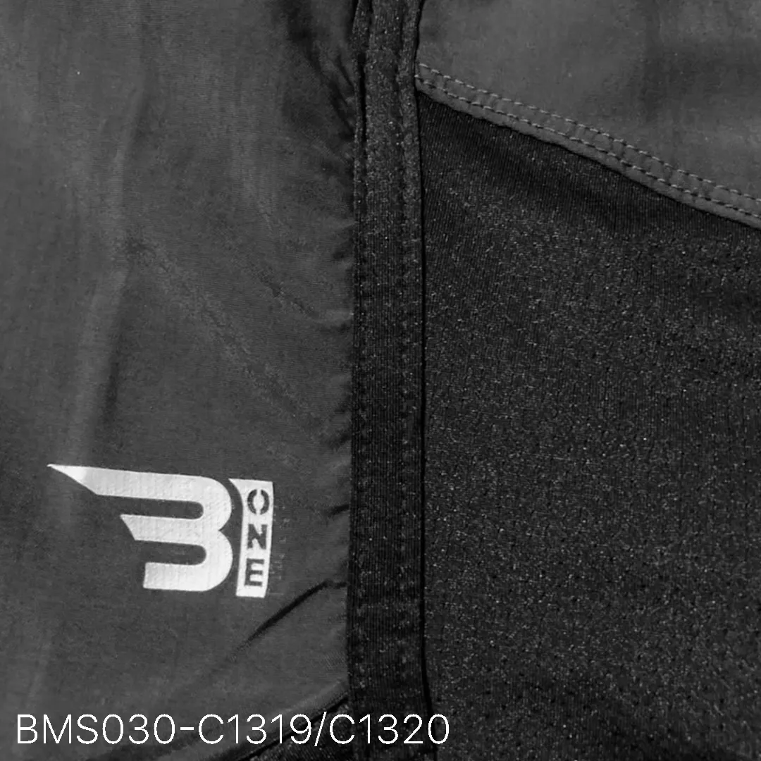 Close up of practice short breathable eyelet mesh fabric and high-density logo
